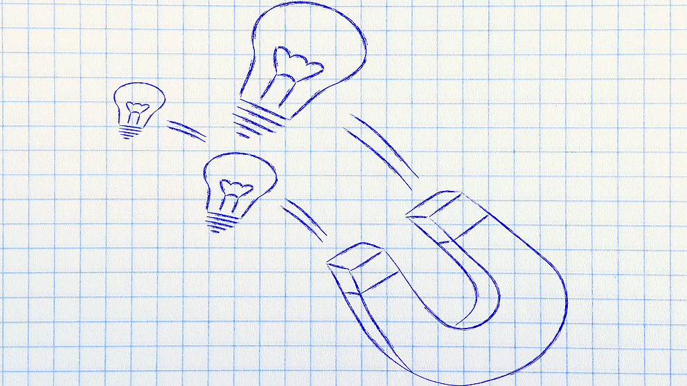 Symbolzeichnung: Magnet mit Glühbirnen