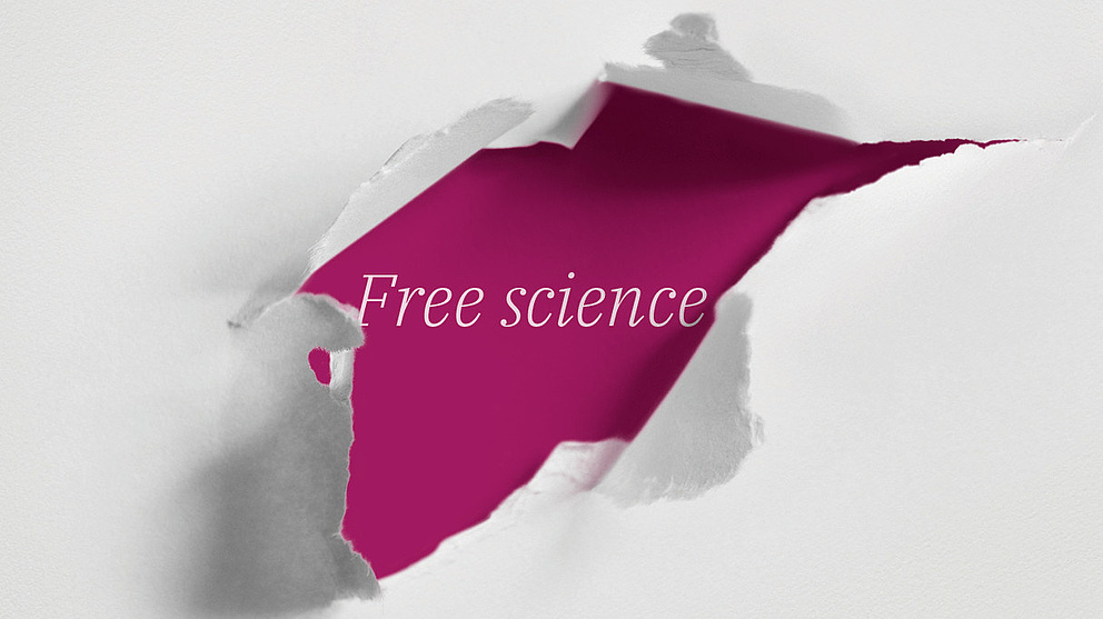 Die weiße Oberfläche hat einen Riss, der einen tiefroten Bereich mit der Botschaft 'Free science' zeigt.