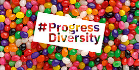 Background Easter Jelly Beans; Text: Progress Diversity